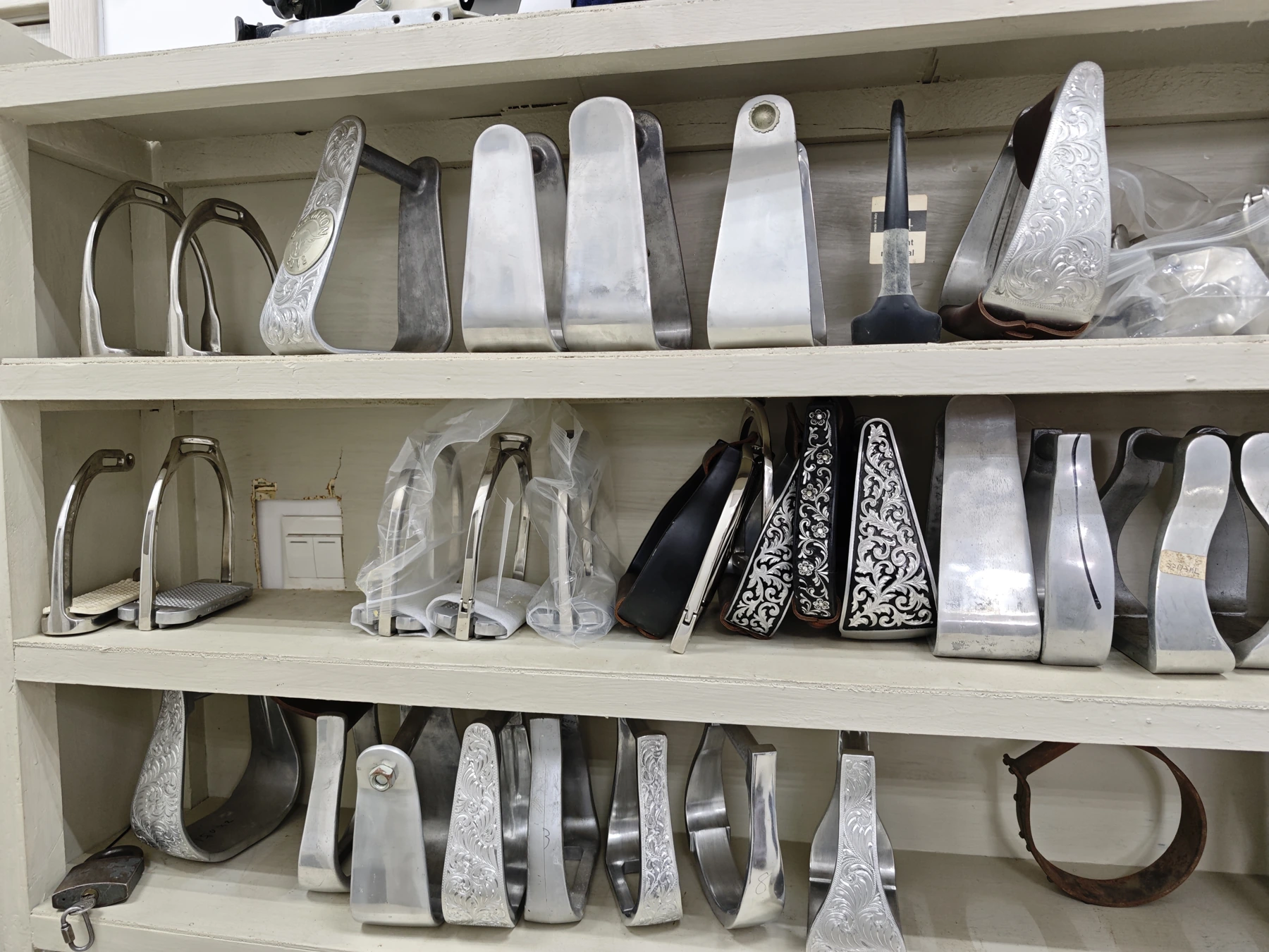 Stirrup samples showing contrasting side profiles and decorative details.