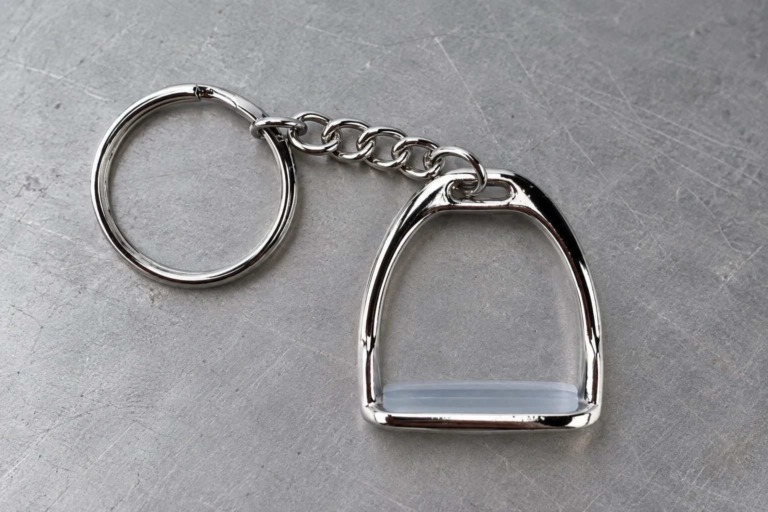 Miniature stirrup key holder showing ornament and ring connection