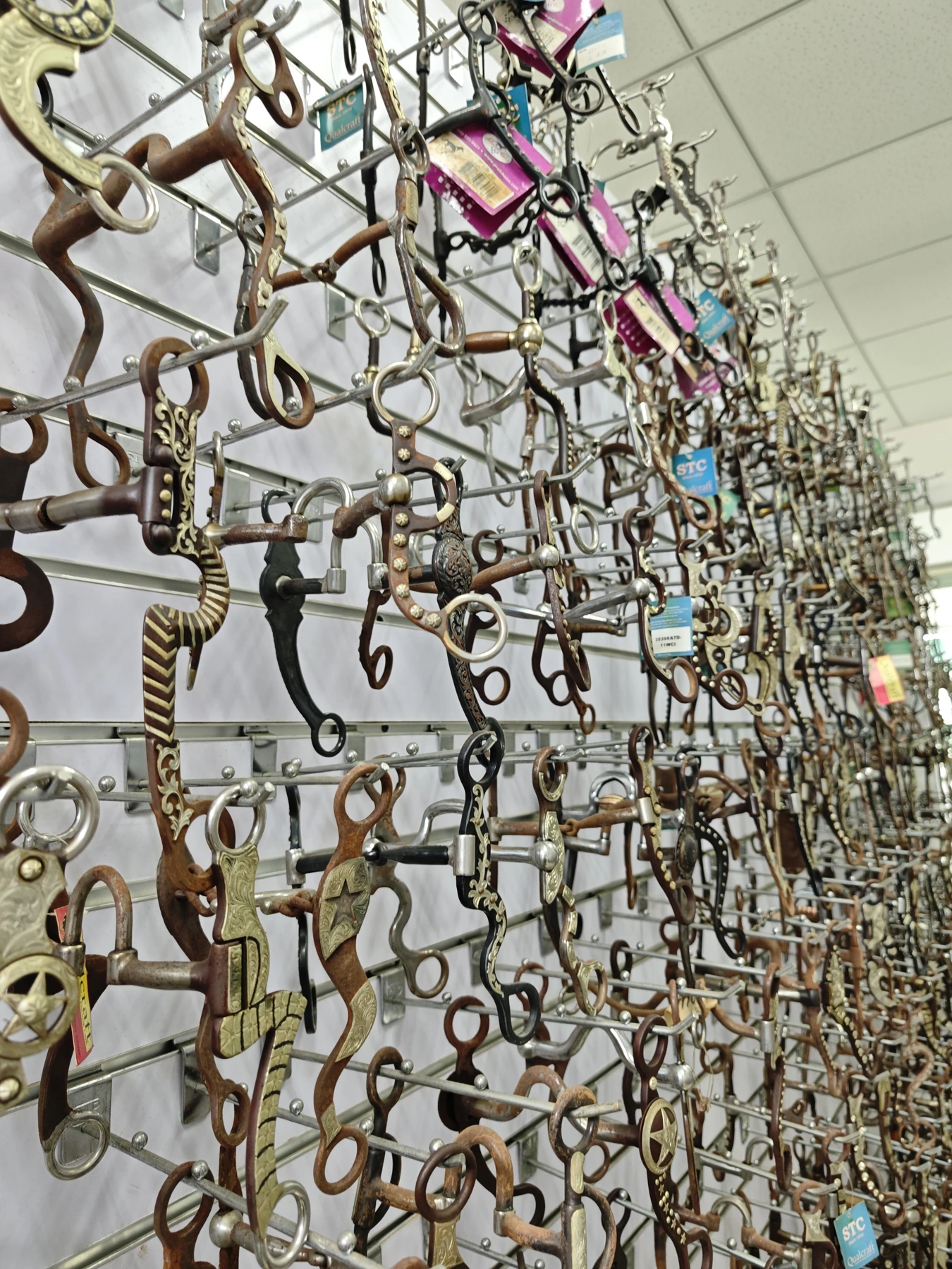 Western-style bit samples displayed with varied side profiles.